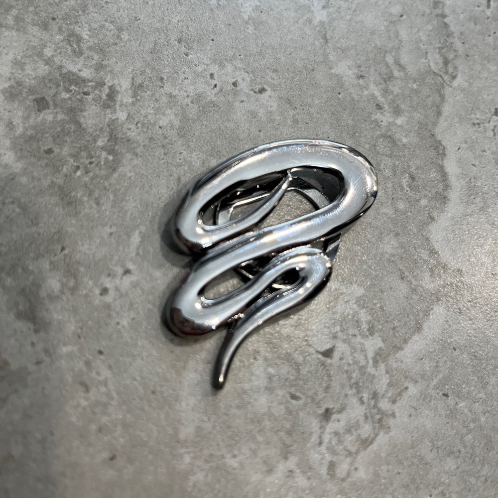 M. J. ENT. Silver “Serpent” brooch